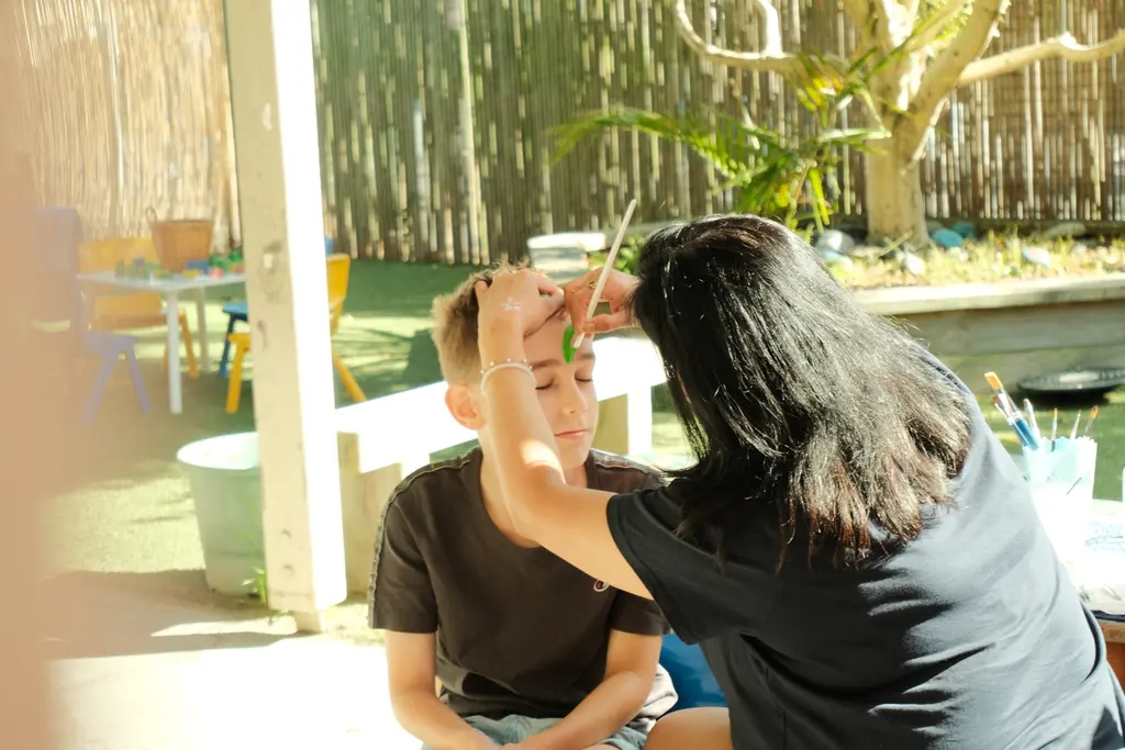 Children and families sharing time together in a Paramount Grove learning area.