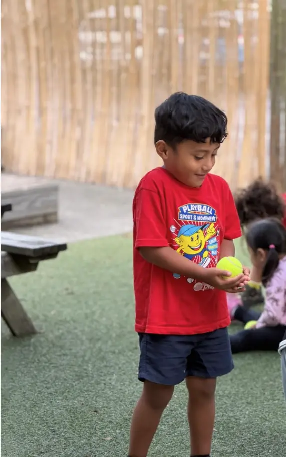 Child enjoying outdoor play at Paramount Grove
