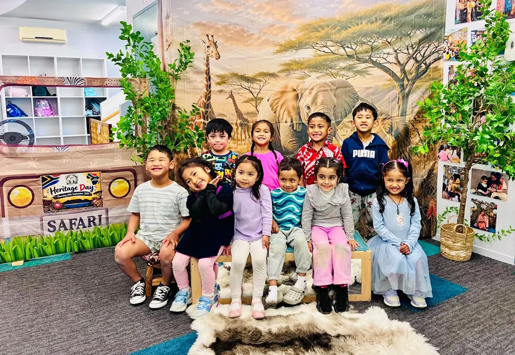 Tamariki gathered beside a safari display for Heritage Day